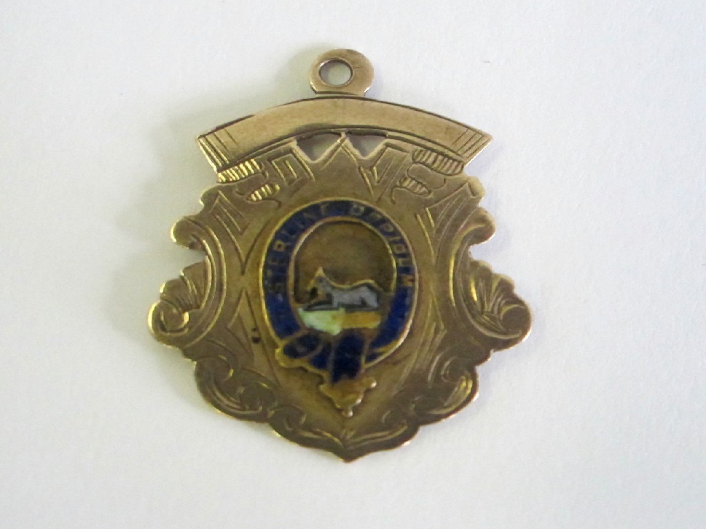 Appraisal: A ct gold and enamel football medal to H Taylor