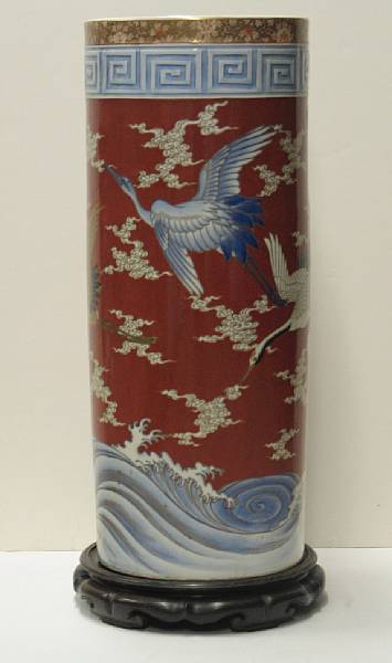 Appraisal: A Japanese porcelain umbrella stand Decorated with a continuous scene