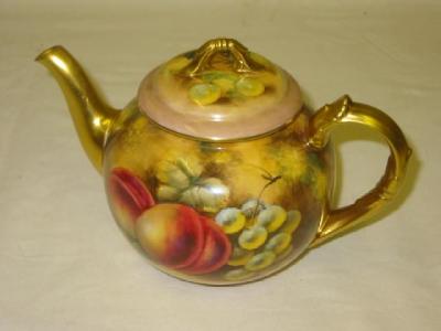 Appraisal: A ROYAL WORCESTER PORCELAIN TEAPOT of globular form with leaf