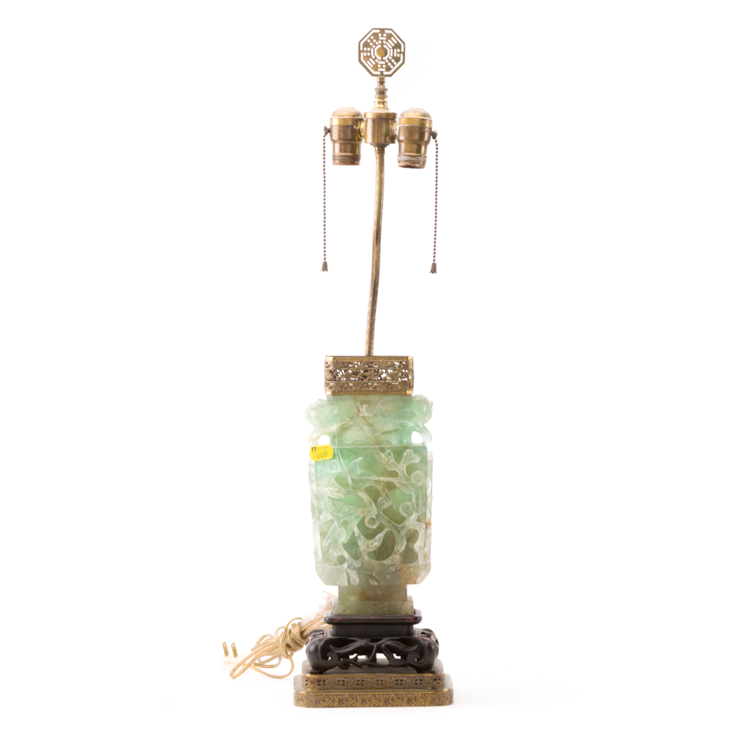 Appraisal: Chinese carved emerald quartz lamp with gilt-metal mounts and wood