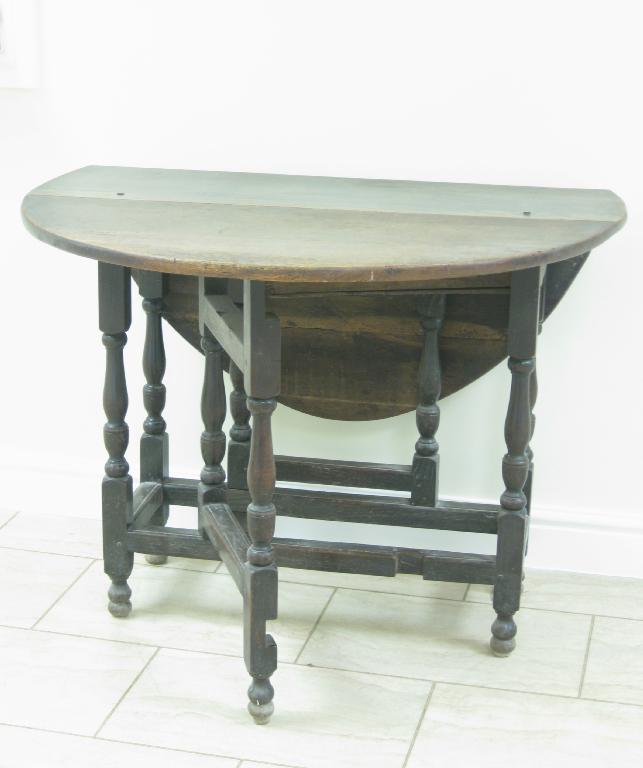 Appraisal: An th Century oak oval Gate-leg Table on baluster turned