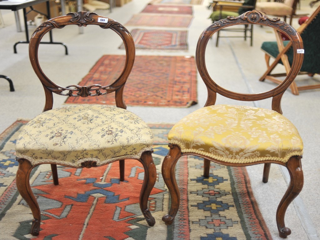 Appraisal: Two Victorian mahogany balloon back dining chairs