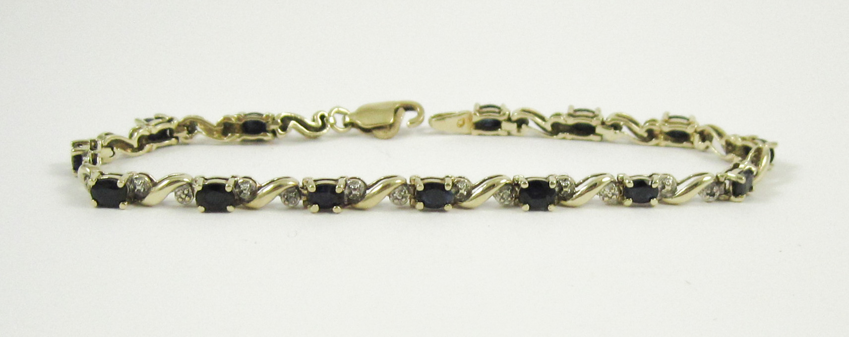 Appraisal: SAPPHIRE DIAMOND AND TEN KARAT GOLD BRACELET measuring - inches