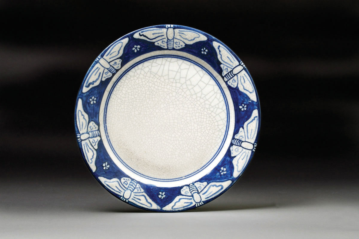 Appraisal: DEDHAM POTTERY 'BUTTERFLY' PATTERN PLATE Painted in dark blue with