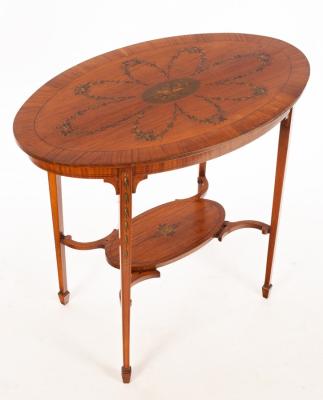 Appraisal: An Edwardian Sheraton Revival satinwood table the oval top with