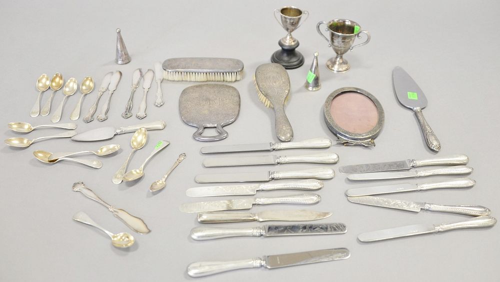 Appraisal: Silver lot with coin demi spoons and weighted sterling Silver