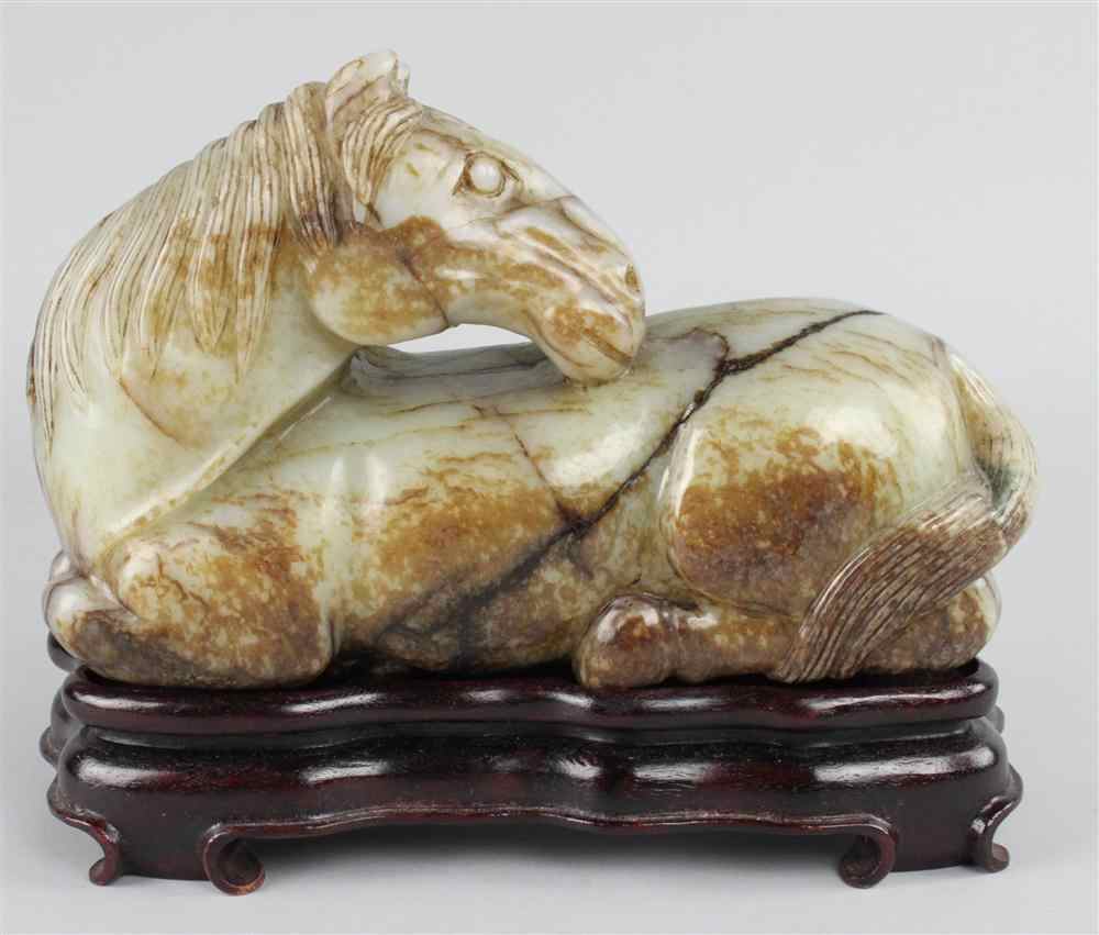 Appraisal: CHINESE GREENISH-GREY AND RUSSET JADE MODEL OF A RECUMBENT HORSE