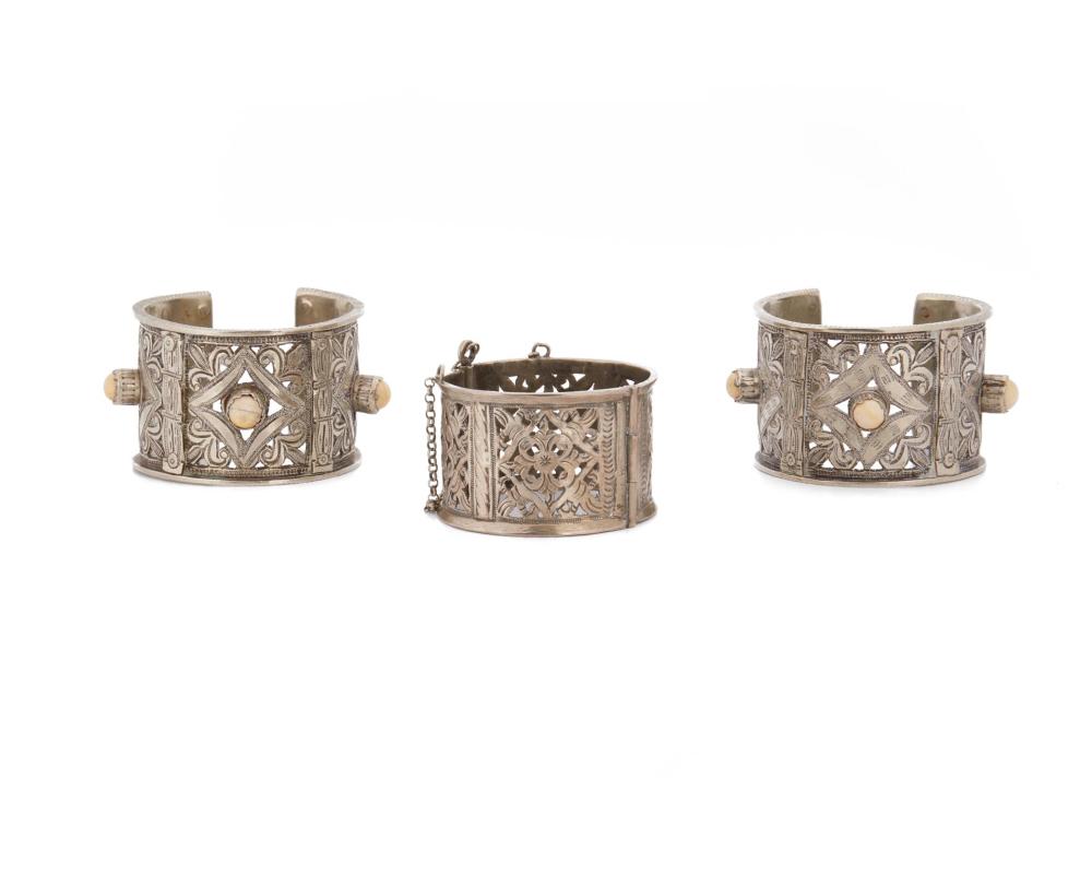 Appraisal: Three North African silver bracelets th Century Each with openwork