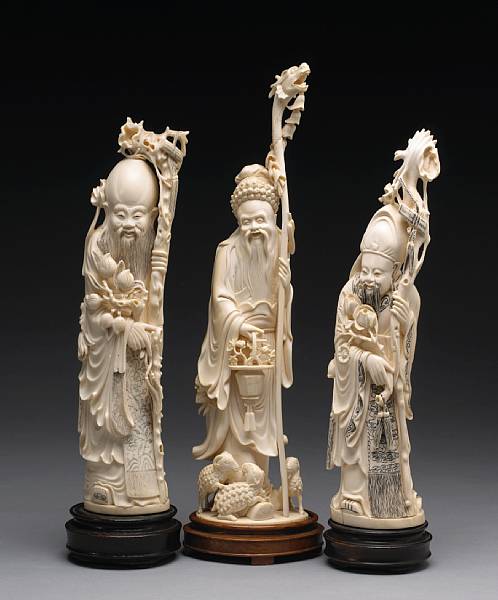 Appraisal: Three ivory figures of an immortal th Century Each standing