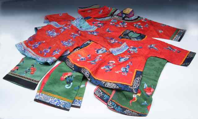 Appraisal: A CHINESE RED SILK CHILDS CEREMONIAL ROBE with floral and