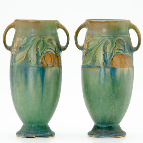 Appraisal: ROSEVILLE Pair of green Baneda ovoid bud vases bruise to