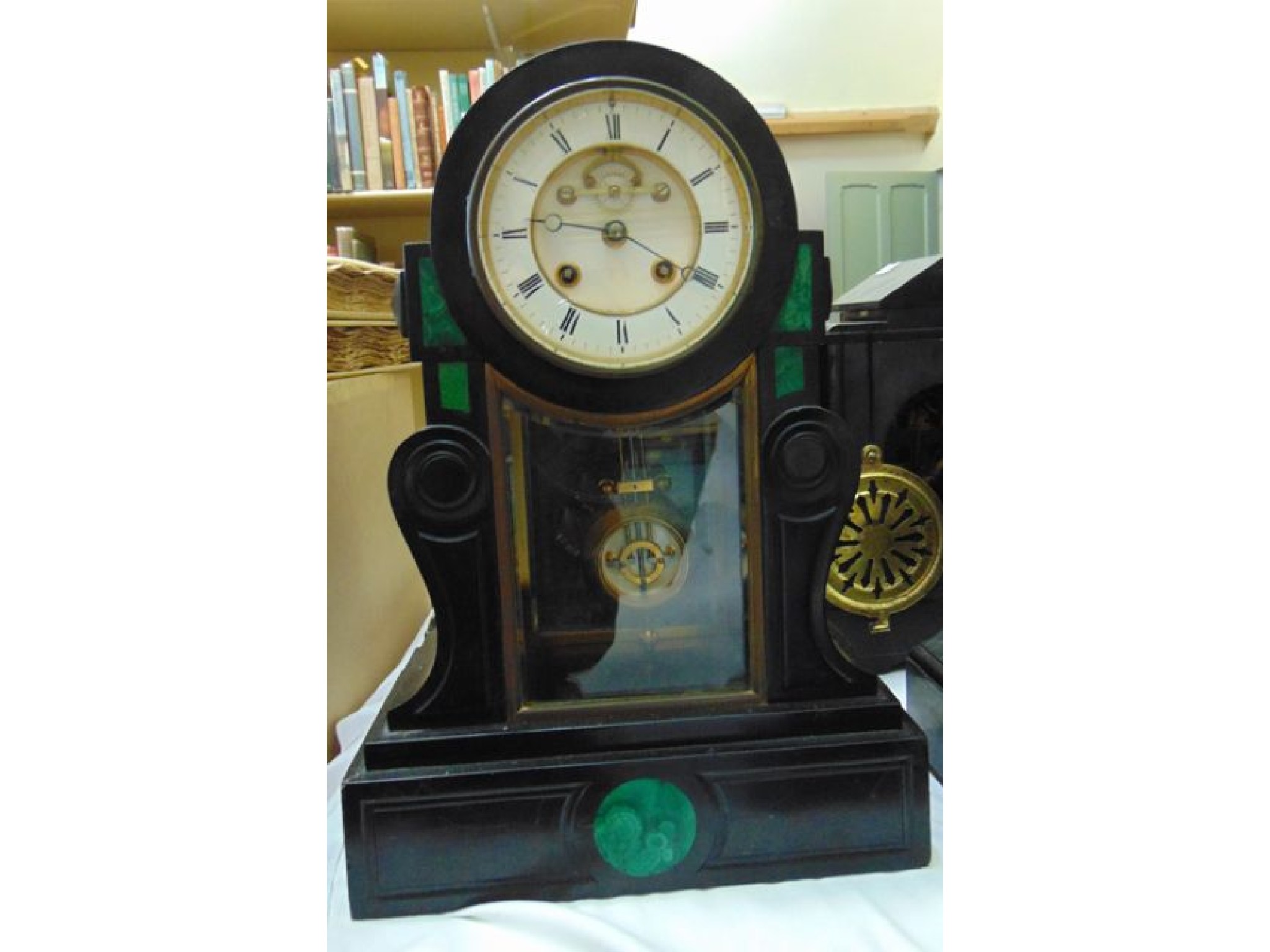 Appraisal: A Victorian black slate and malachite inlaid mantle clock the