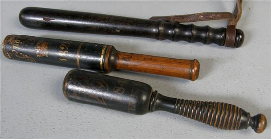 Appraisal: Three turned wood truncheons comprising a George IV black gilt