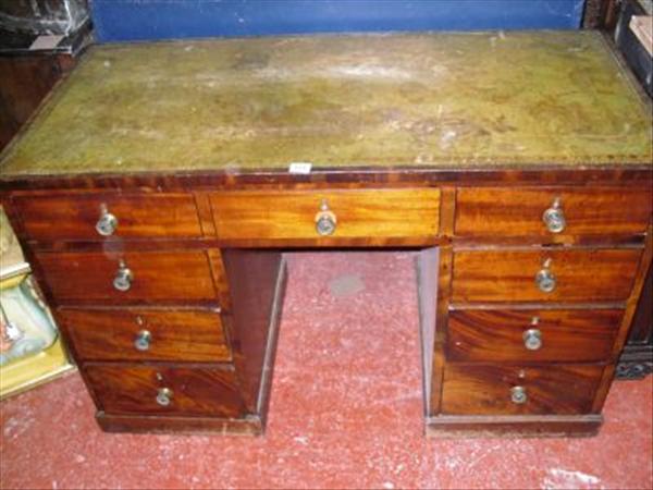 Appraisal: A mahogany kneehole desk