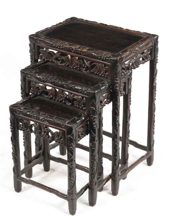 Appraisal: A Chinese carved hardwood nest of three tables