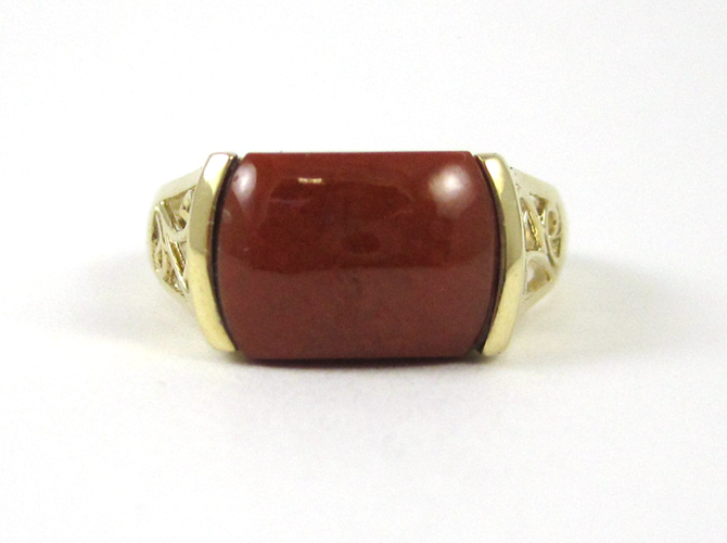 Appraisal: RED JADE AND FOURTEEN KARAT GOLD RING set with a