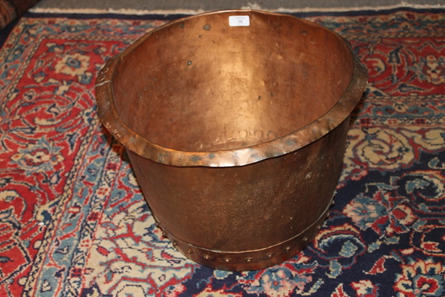 Appraisal: A SMALL COPPER LOG BIN with studded decoration across