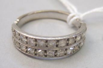 Appraisal: A diamond set half hoop ring mounted with two rows