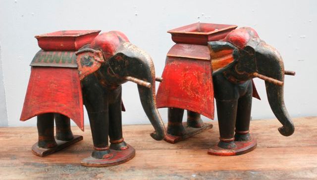 Appraisal: A pair of polychrome and gilded elephants with red painted