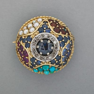 Appraisal: JEWELED K GOLD BOMBE BROOCH ca Circular faceted sapphire framed