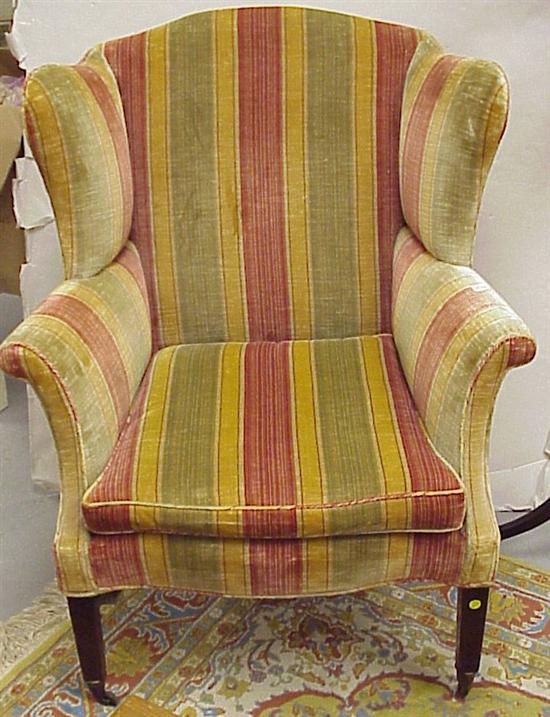 Appraisal: Upholstered wing chair chenille striped upholstery Marlborough legs missing caster