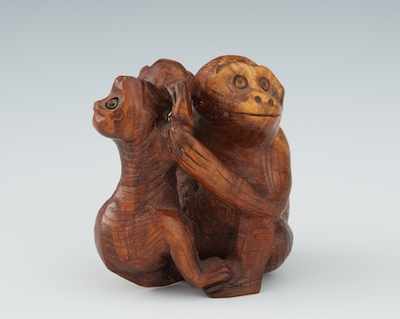 Appraisal: A Carved Wood Monkey and Peach Netsuke Carved depicting two