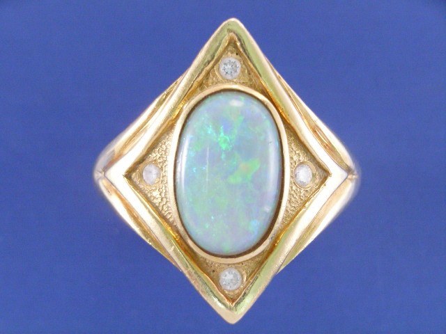 Appraisal: An ct gold opal and four diamond set dress ring