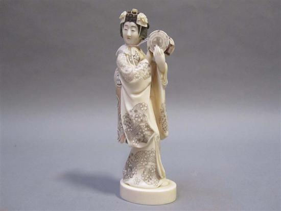 Appraisal: JAPANESE POLYCHROME DECORATED IVORY OKIMONO OF A WOMAN th C