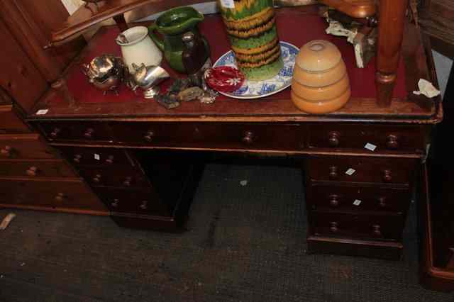 Appraisal: A TH CENTURY PEDESTAL DESK the red leatherette inset top