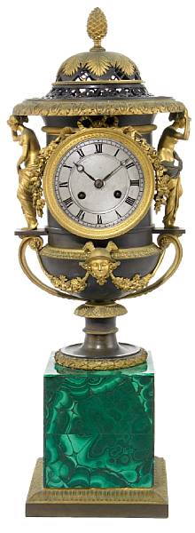 Appraisal: A French gilt and patinated bronze malachite veneered mantel clock