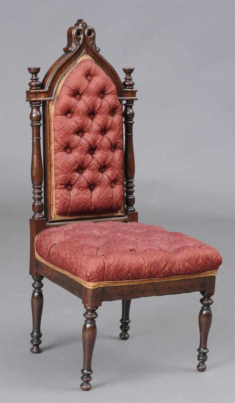 Appraisal: VICTORIAN UPHOLSTERED CHILD'S CHAIR With a neo-gothic shaped tufted backrest