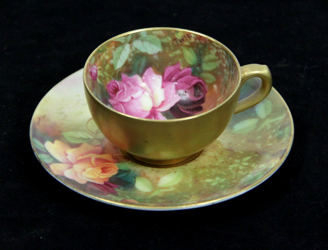 Appraisal: A Royal Worcester cabinet cup and saucer signed TWIN cm