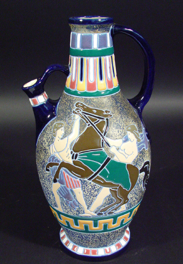 Appraisal: Large Amphora ewer enamelled with Romanesque figures onto a coloured