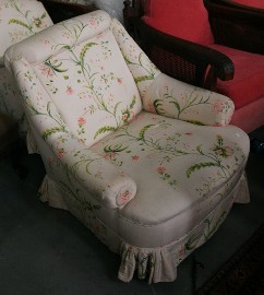 Appraisal: An Edwardian armchair together with another armchair upholstered in matching