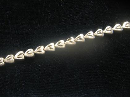 Appraisal: karat yellow gold heart shape link flexible bracelet th century