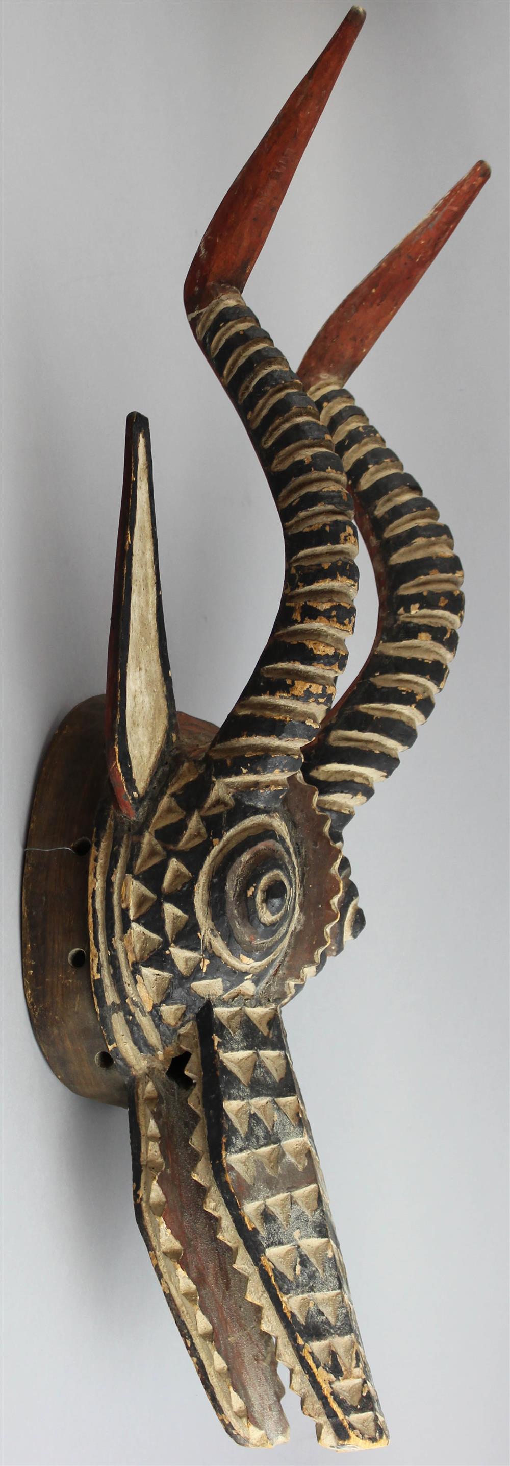 Appraisal: BURKINA FASO POLYCHROME ZOOMORPHIC MASK having a striking coloration of