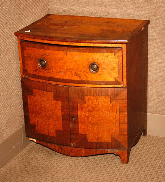 Appraisal: A George III mahogany bow front cabinet third quarter th