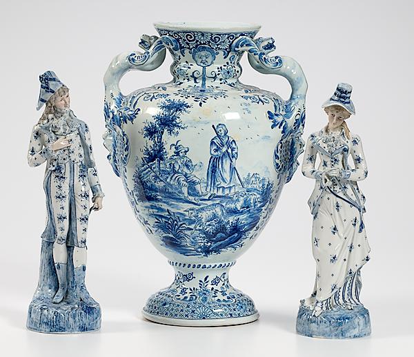 Appraisal: ENGLISH FAIENCE URN AND TWO CONTINENTAL FIGURES English th century