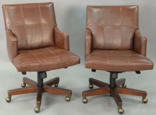 Appraisal: Pair of Councill leather swivel office armchairs Pair of Councill