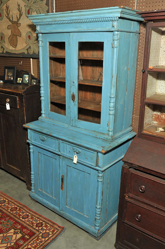 Appraisal: TWO PIECE STEPBACK CUPBOARD Blue painted cupboard having a dentil