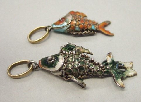 Appraisal: Two enameled pendants designed as differing articulated fish probably Oriental