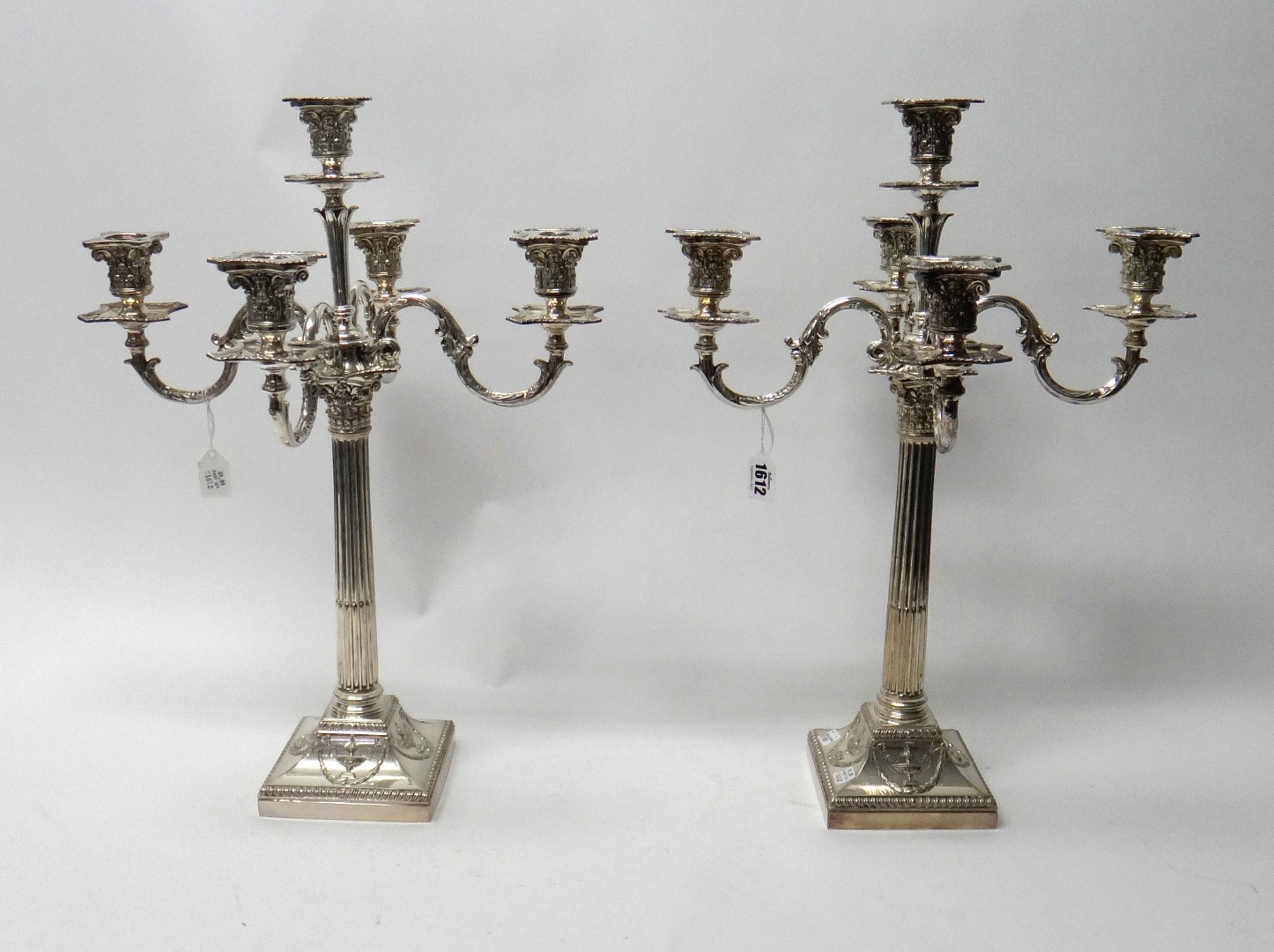 Appraisal: A pair of silver plated five light table candelabra each