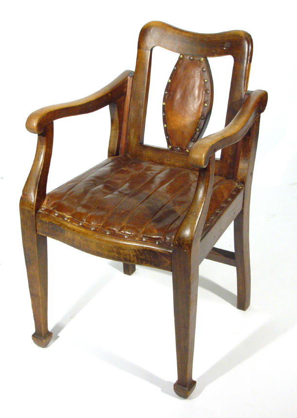 Appraisal: Edwardian walnut framed open armed barber's chair with brown leather