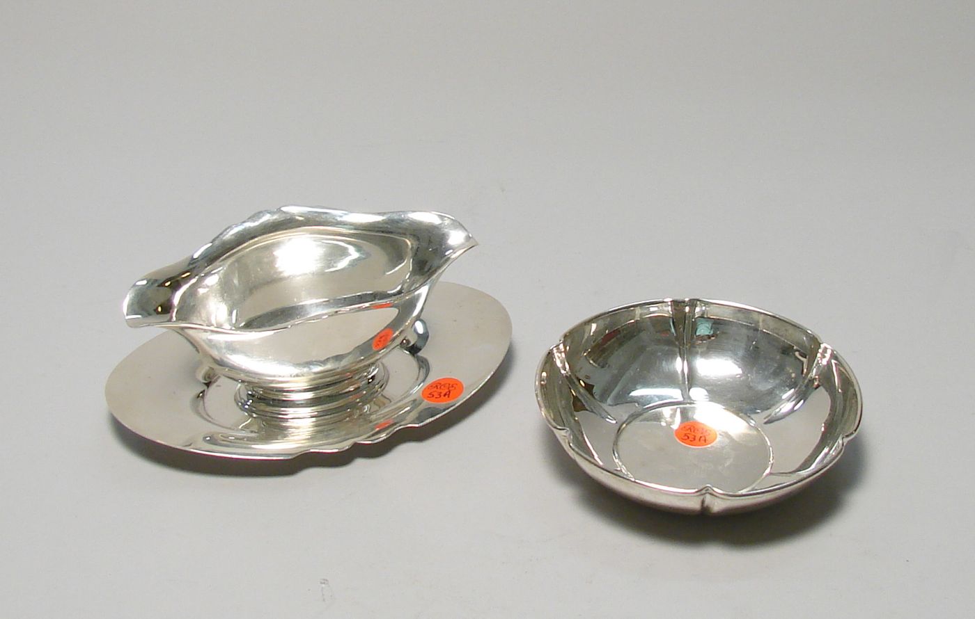 Appraisal: TWO PIECES OF STERLING SILVER HOLLOWWARE Sauceboat with under tray