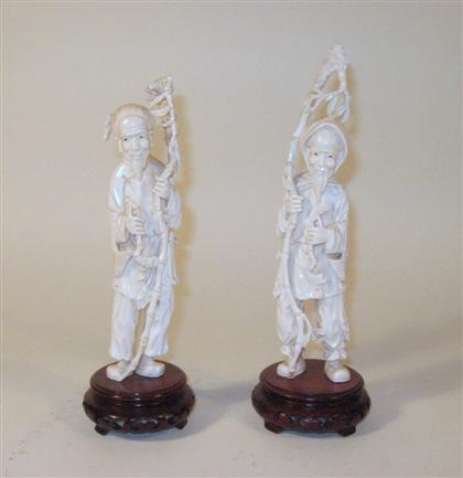 Appraisal: Pair of Chinese carved elephant ivory figureslate qing dynasty