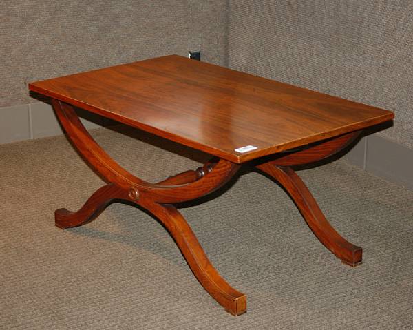 Appraisal: A pair of Regency style walnut low tables th century