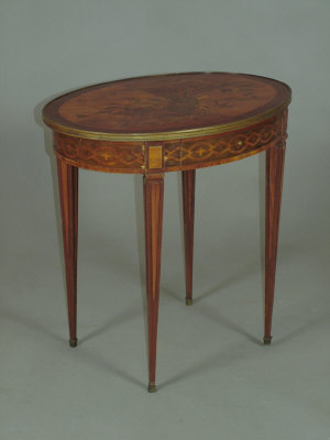 Appraisal: A Continental and marquetry inlaid oval occasional table late th