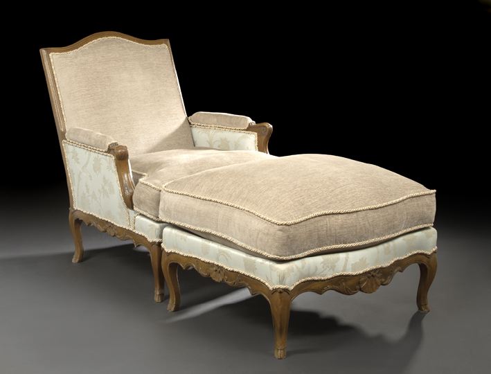 Appraisal: Louis XV-Style Fruitwood Bergere and Ottoman the bergere with a