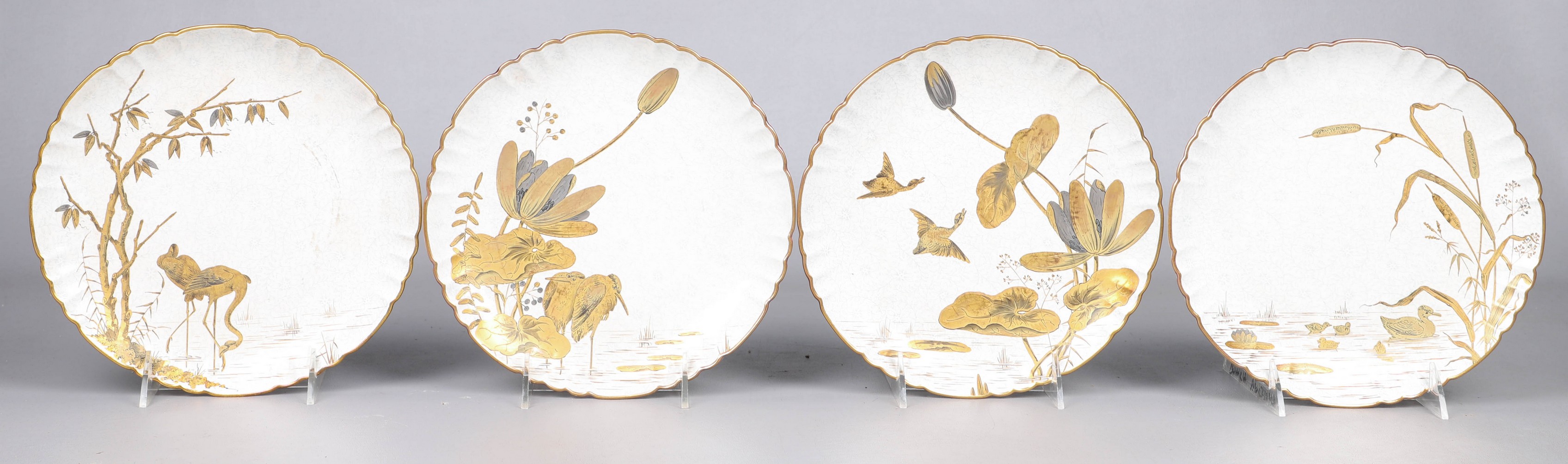 Appraisal: Hand gilded porcelain plates stamped illegibly at back scalloped trim