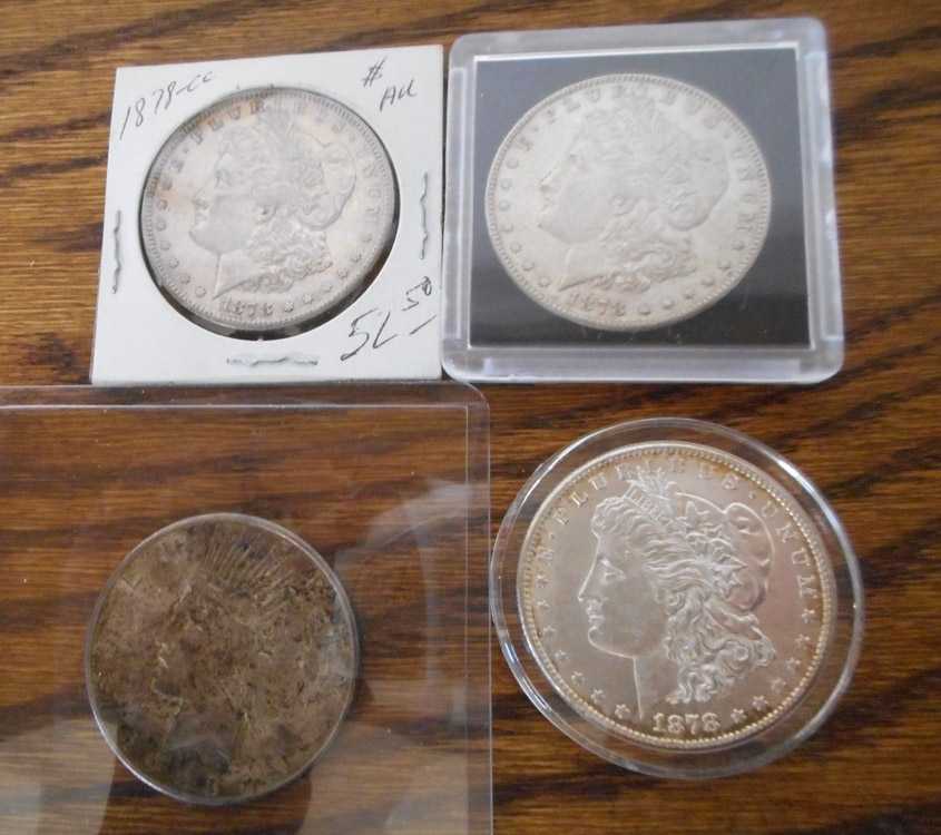 Appraisal: FOUR U S SILVER DOLLARS Three Morgan type -CC and